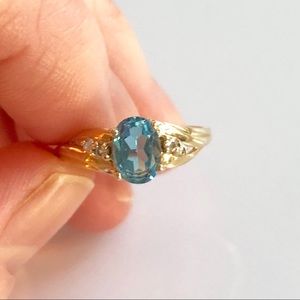 Blue Topaz 10k gold ring with 4 cz